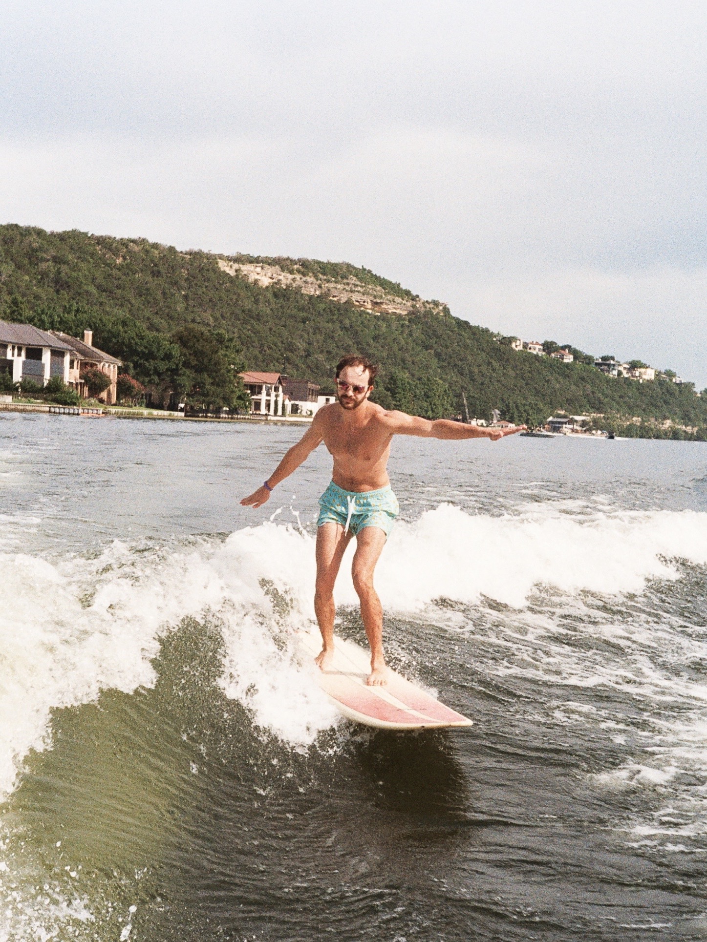 Justin wake surfing on a lake